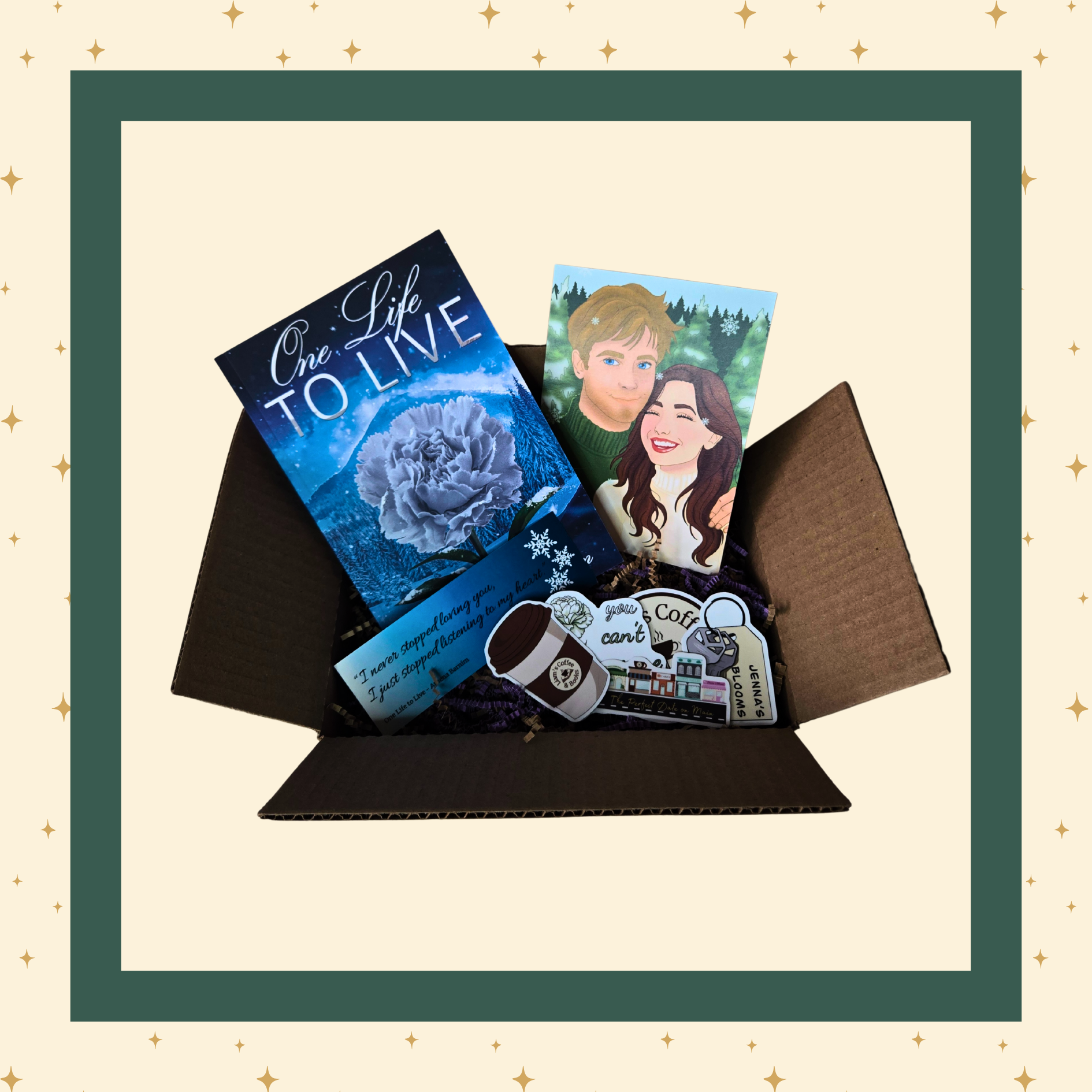 An open gift box containing a curated selection of items: a blue-covered book titled "One Life To Live," art featuring the main characters of the book, several themed stickers, and a themed bookmark.